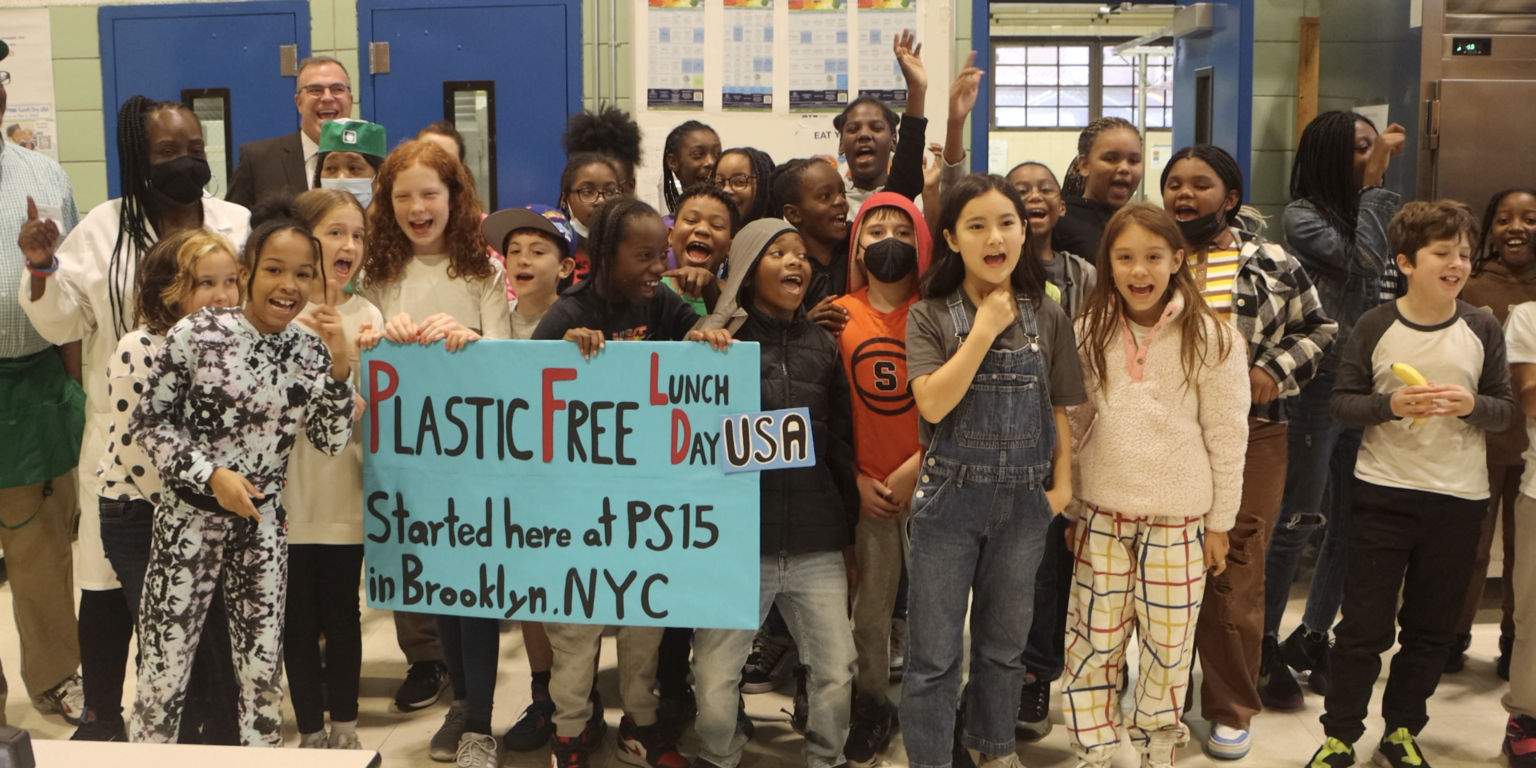 Kids signing at the charity