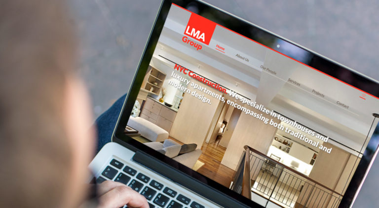 LMA Group website on laptop screen