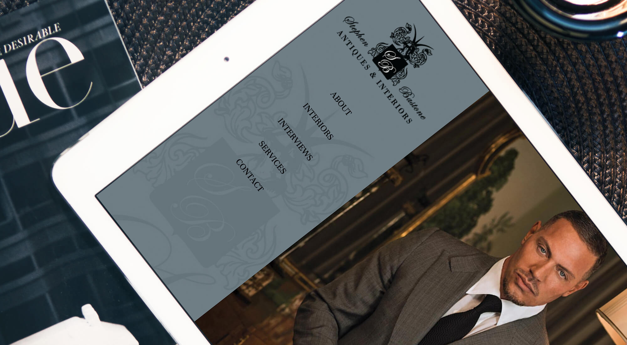 Steven Bastone Antiques and Interiors website on iPad screen
