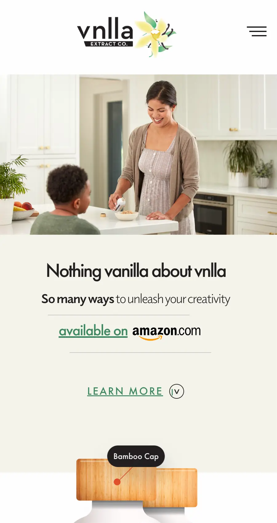 A woman smiles while baking with a young boy in a modern kitchen. Text promotes vnlla extract, available on Amazon, with a bamboo cap product detail below—perfect inspiration for website design for ecommerce brands.