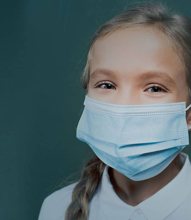 young girl with medical face mask on