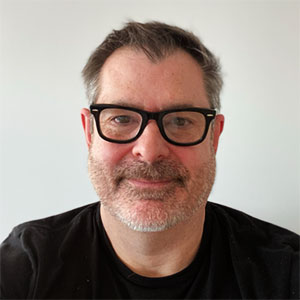 Headshot of Conrad, president of e9digital