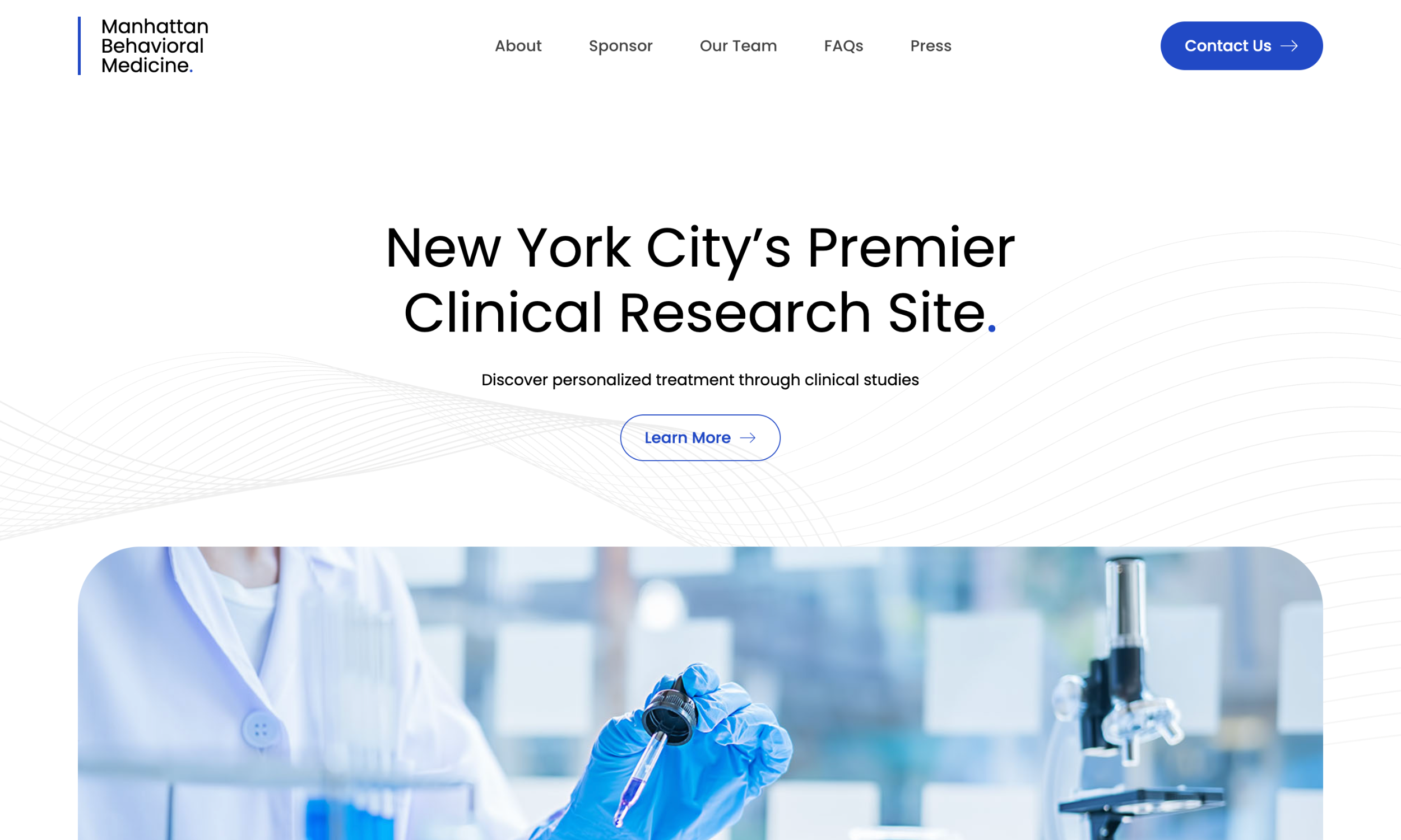 A website homepage for Manhattan Behavioral Medicine promoting clinical research in New York City, featuring navigation links, an image of a scientist in a lab, and a modern pharmaceutical website design.