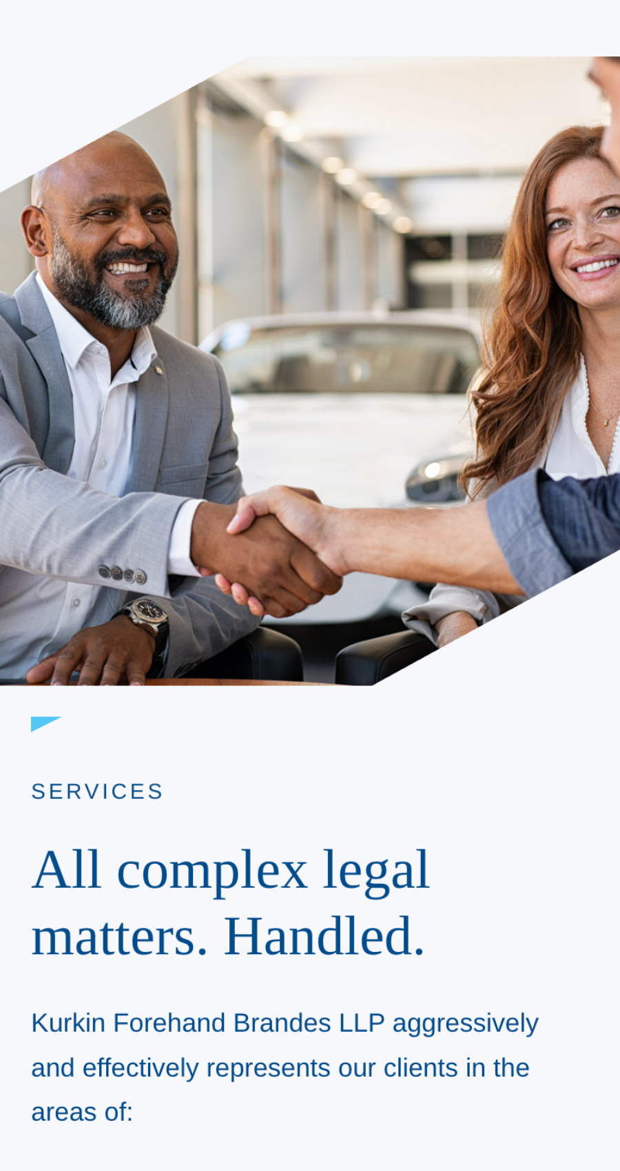 A man and a woman in business attire smile and shake hands with a third person across a table in an office setting, discussing the best legal web design solutions for their firm.