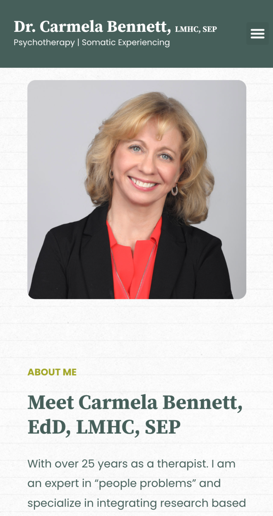A professional headshot of Dr. Carmela Bennett, smiling in a black blazer and red top, with text introducing her as an expert therapist specializing in somatic experiencing—perfect for a psychotherapy website design.