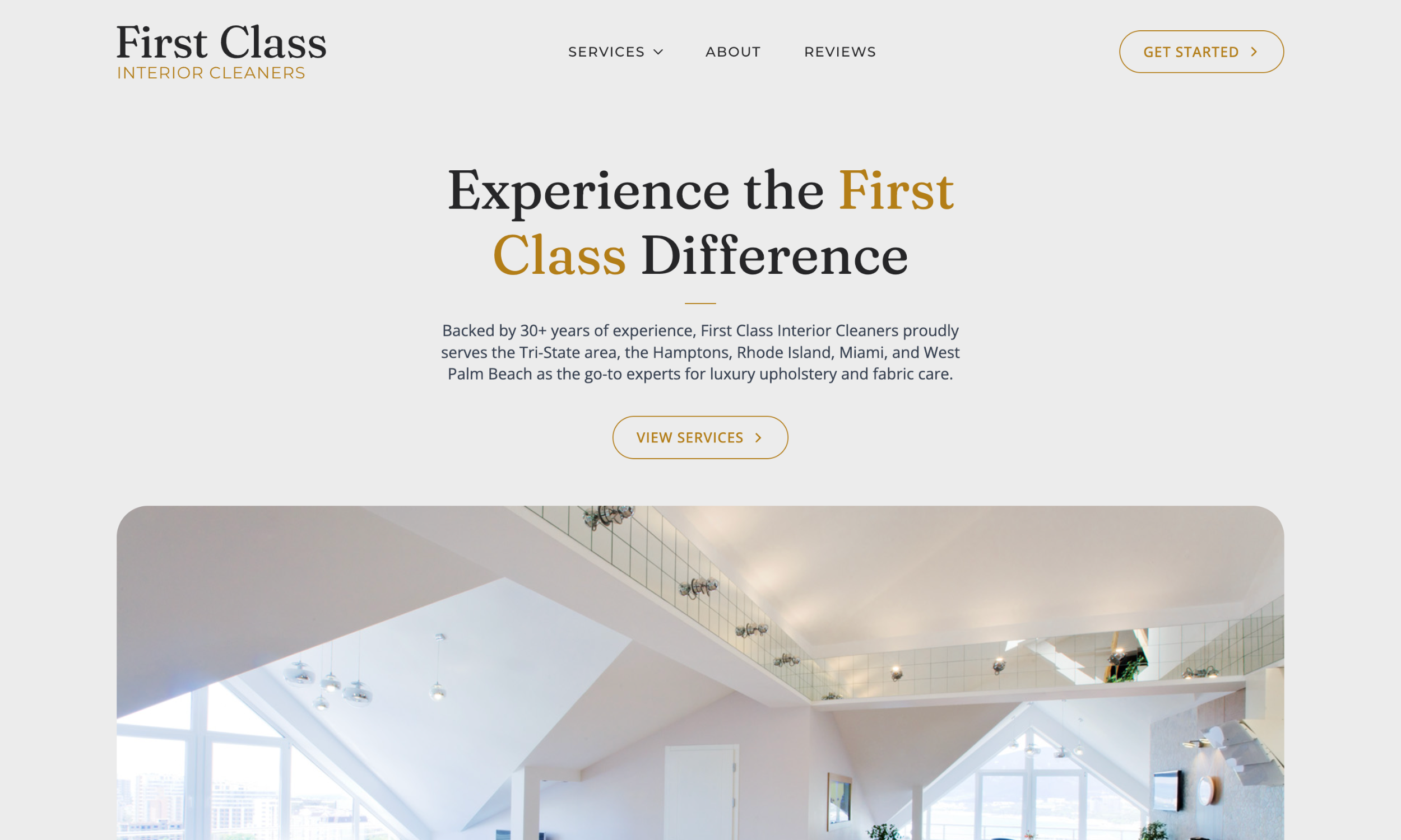Screenshot of First Class Interior Cleaners homepage featuring a modern interior photo, navigation menu, and headline promoting luxury services—an example of elegant carpet cleaning website design.