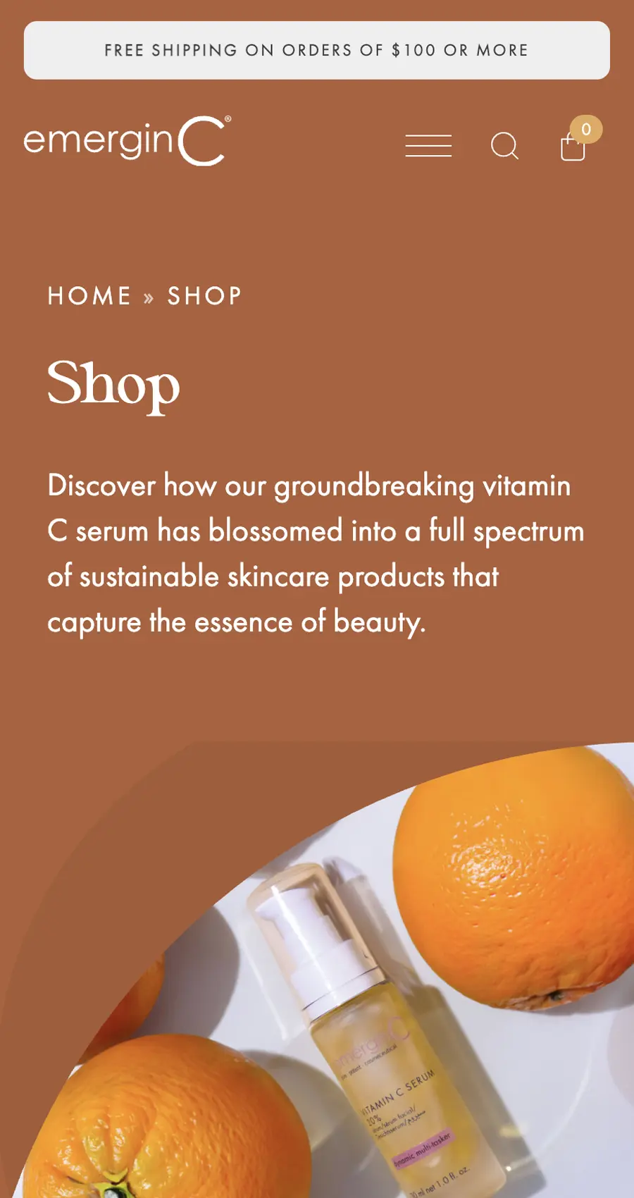 A bottle of vitamin C serum on a white plate beside two oranges, featured on a skincare shop webpage with a brown background.