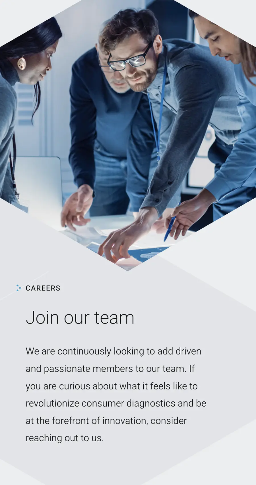 Four professionals gather around a table reviewing documents, with text inviting driven individuals to join a consumer diagnostics innovation team.