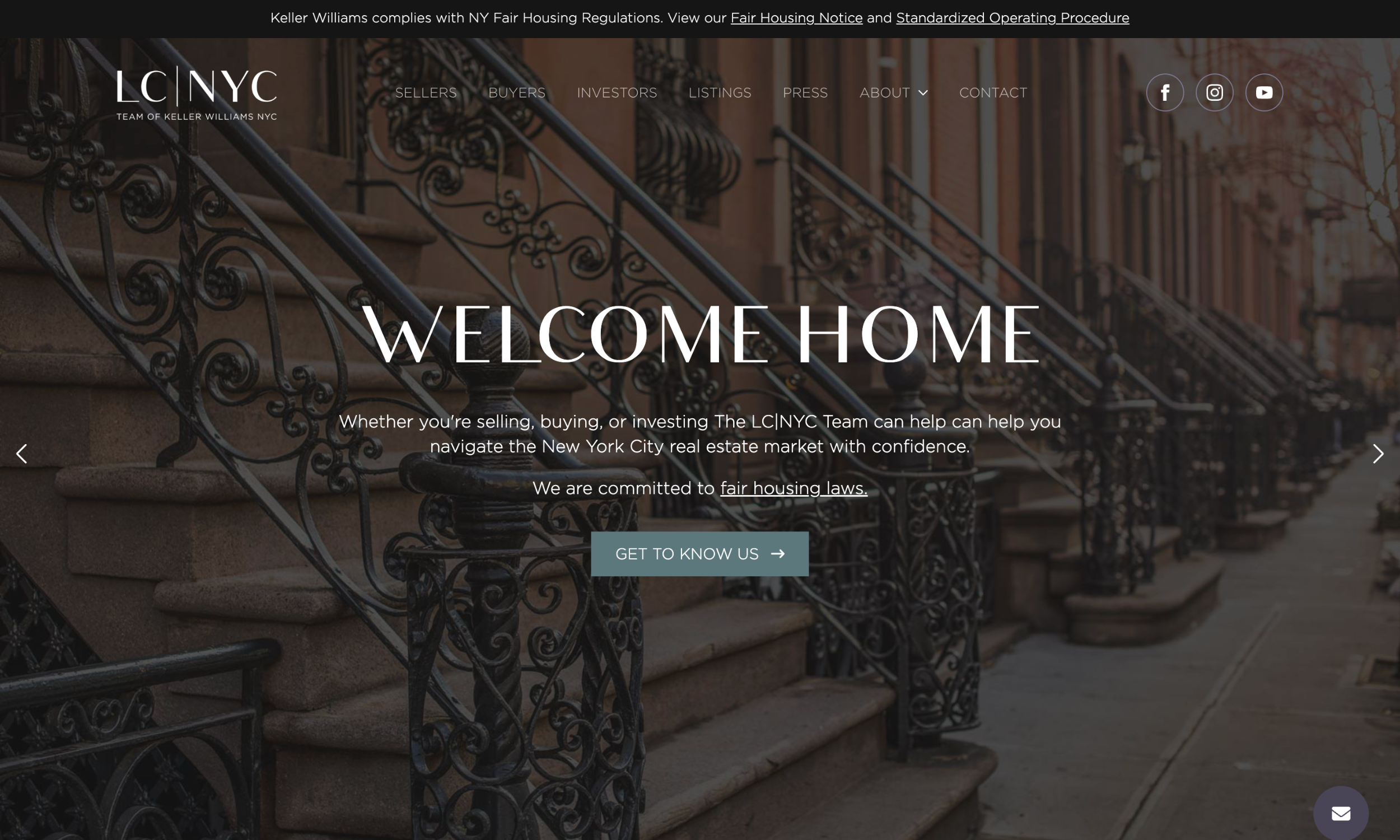 Landing page of a real estate website with a background image of brownstone building steps and text welcoming users to LCNYC, a Keller Williams team in New York City.