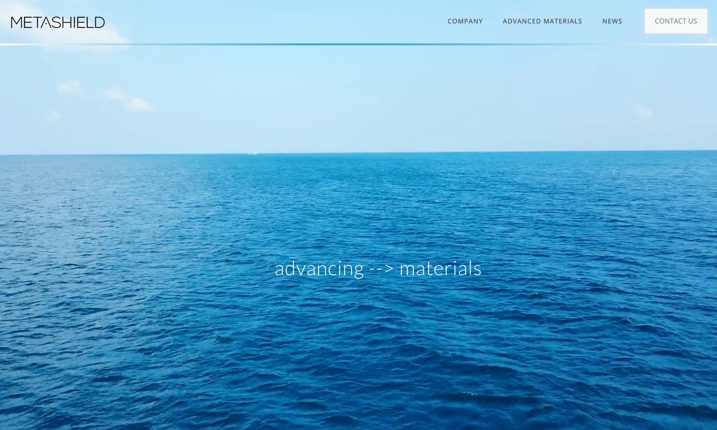 Wide view of a blue ocean under a clear sky with the text "advancing --> materials" overlaying the water, and website navigation visible at the top.